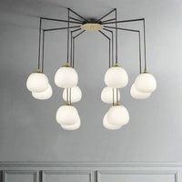 Total statement chandelier comprising 12 opal pendants on a beautifully structured matt black frame with brushed gold accents. Great design doesn't get much better absolutely stunning. A real spread of light from the spaced globes.