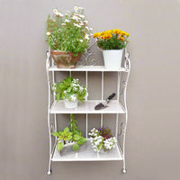 3 tier white folding shelf, great indoors or outdoors. With plants or books, this versatile little shelf can be placed anywhere, in any room, or folded neatly away when not in use.