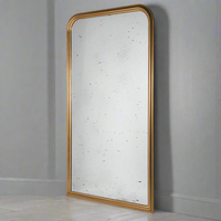 Massive gold beaded arched mirror with aged glass. A huge statement mirror, with a gold beaded arched frame enhanced by the vintage aged glass. Perfect hallway mirror, the soft reflection of the glass contrasting with the bright gilded frame. In a living room, to get a great vintage feel. Perfect in any space