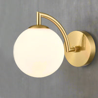 Stylish aged brass wall light with a sphere shaped opal glass. It creates an instant classy and elegant feel. With an IP Rating 44, it can be use in the bathroom transforming your space with a glamorous look.
H: 16 cm W: 12 cm