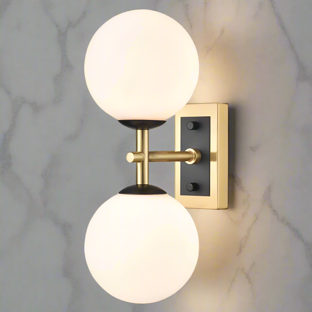 Stylish aged brass and matt black metal fixtures with two round opal glasses. It creates an instant classy and elegant feel. With an IP Rating 44, it can be use in the bathroom transforming your space with a glamorous look.
H: 30 cm W: 12 cm