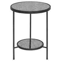 A modern side table that exudes vintage charm with an aged glass top with sleek black metal frame and an additional lower shelf offering practical storage space.