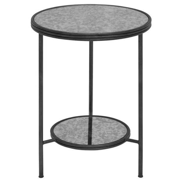 A modern side table that exudes vintage charm with an aged glass top with sleek black metal frame and an additional lower shelf offering practical storage space.