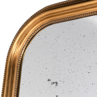 Massive gold beaded arched mirror with aged glass. A huge statement mirror, with a gold beaded arched frame enhanced by the vintage aged glass. Perfect hallway mirror, the soft reflection of the glass contrasting with the bright gilded frame. In a living room, to get a great vintage feel. Perfect in any space