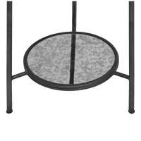 A modern side table that exudes vintage charm with an aged glass top with sleek black metal frame and an additional lower shelf offering practical storage space.
