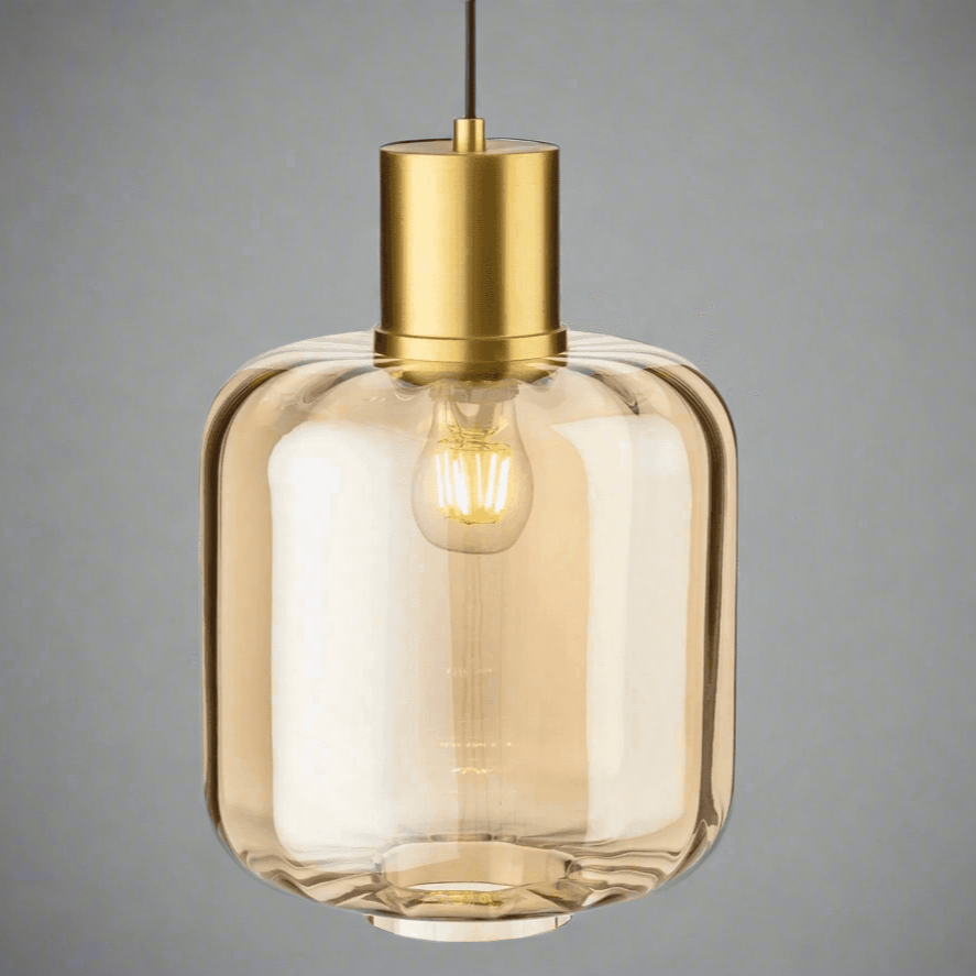 Large amber glass pendant light with brushed gold metal top, a muted colour to add a glow to your kitchen.