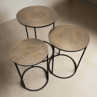 A set of three antique bronze top side tables on a metal iron base. A Simple but beautiful clean line. Can be purchased as a set or individually.