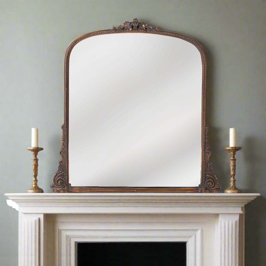 A totally classically shaped overmantle, perfect for a period interior. It has a dark finish with a minimal gold fleck running through,  a large size to add light and perspective to any room.  The right shape, colour and finish for a period home and fireplace.
Can be viewed in the Chiswick store with a range of other over mantle mirrors.  Mirrors in West London.