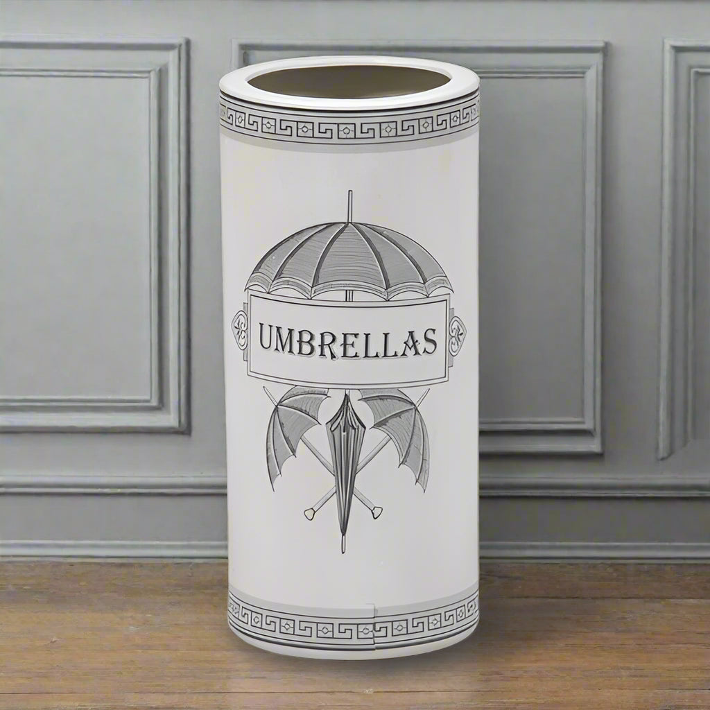 Antiqued White Ceramic Umbrella Stand.  Victorian style imagery on the front of this stand adds to it's vintage quality, with cross keys banding at the top and base, a really decorative addition to your hall.