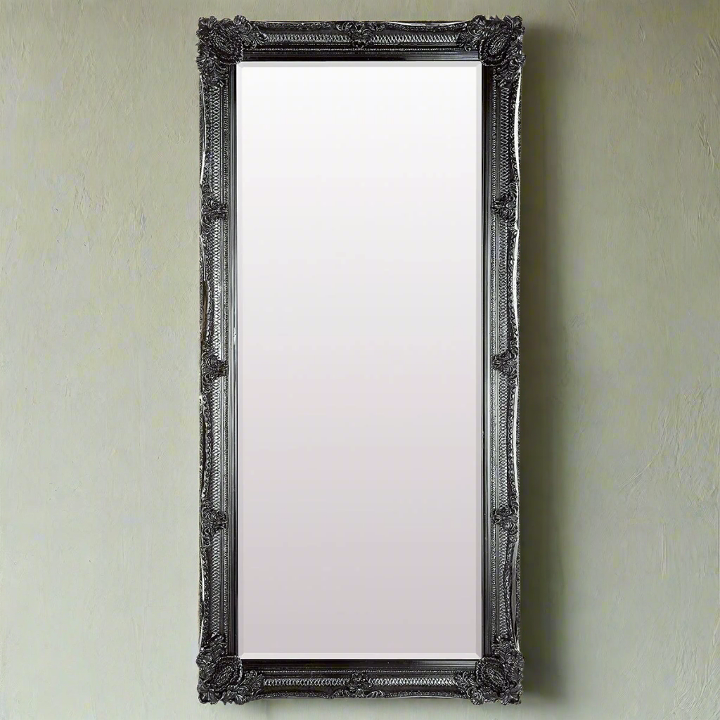 Large ornate framed black roccoco style mirror, a real statement in this colour, dramatic yet elegant.  Great in an urban, industrial type space, the colour would work perfectly and there is enough mirror to really light up any interior. 
H: 165 cm W: 79 cm D: 6 cm