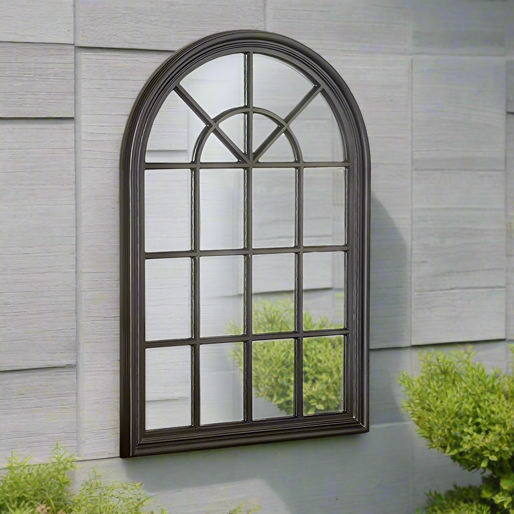 Distressed soft black finished, wooden, arched window mirror. These window mirrors work really well in a patio setting, flashing light into the darkest of areas. 