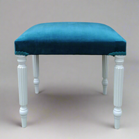 This blue velvet dressing table stool is handmade in our workshop in England from start to finish. It is a luxurious wing back chair with a luxurious shimmer