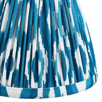 16cm tapered shade with a clip to fit golf or candle bulbs. Unique Ikat pattern design in blue & white with tapered edge detailing.
Perfect when paired with decorative table lights, wall lights or chandeliers.