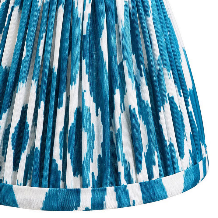16cm tapered shade with a clip to fit golf or candle bulbs. Unique Ikat pattern design in blue & white with tapered edge detailing.
Perfect when paired with decorative table lights, wall lights or chandeliers.