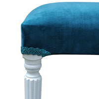 This blue velvet dressing table stool is handmade in our workshop in England from start to finish. It is a luxurious wing back chair with a luxurious shimmer