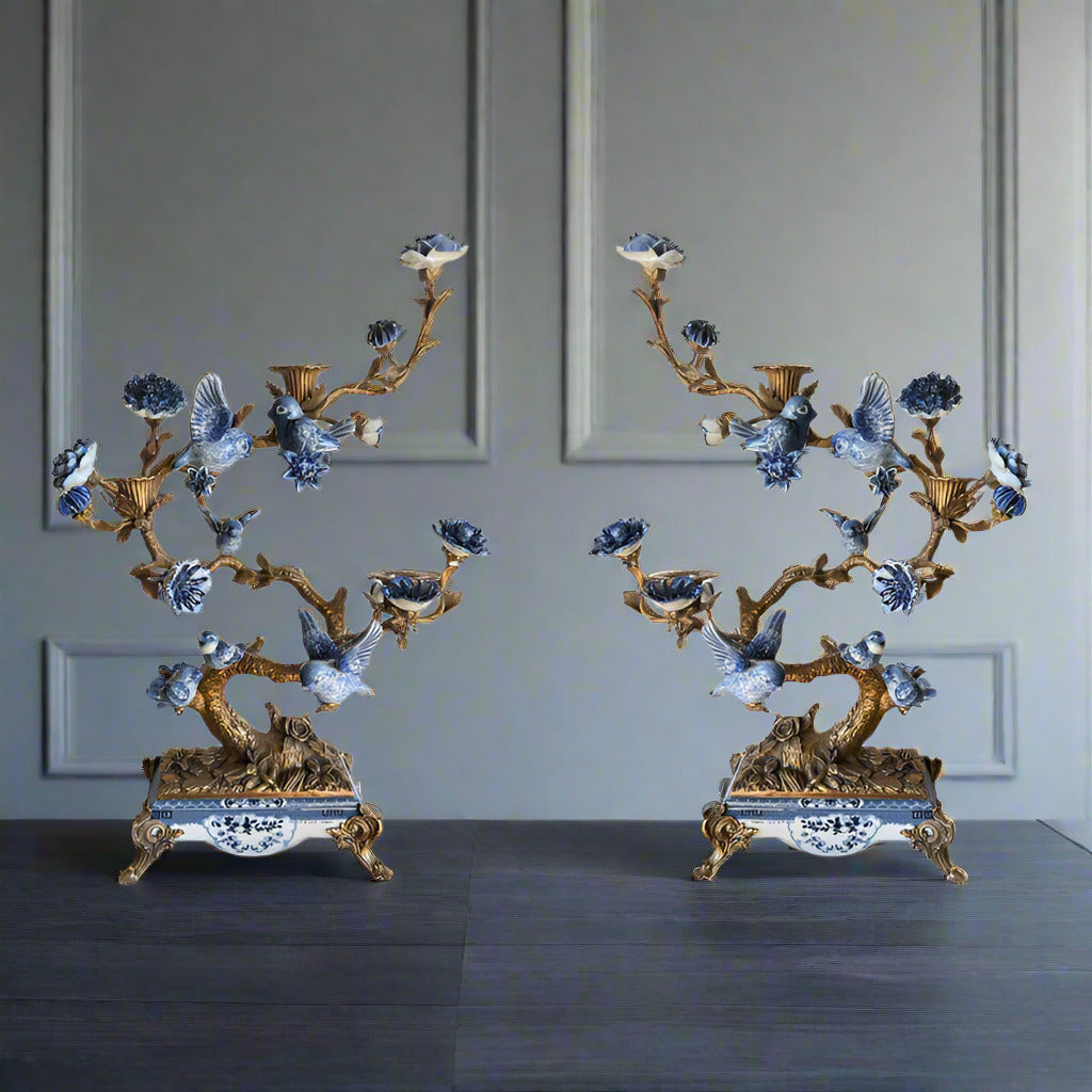 A larger version of the blue and white porcelain and bronze candlesticks, these candelabra are a total statement piece, arranged as a pair or singly they are a luxurious addition to any room.  They are set on a base of porcelain and bronze and the figurative 'branches' covered in pretty small birds and candleholders.  Originally made in the Georgian era for large stately homes you can now adorn your own home with these exquisite ornaments. 