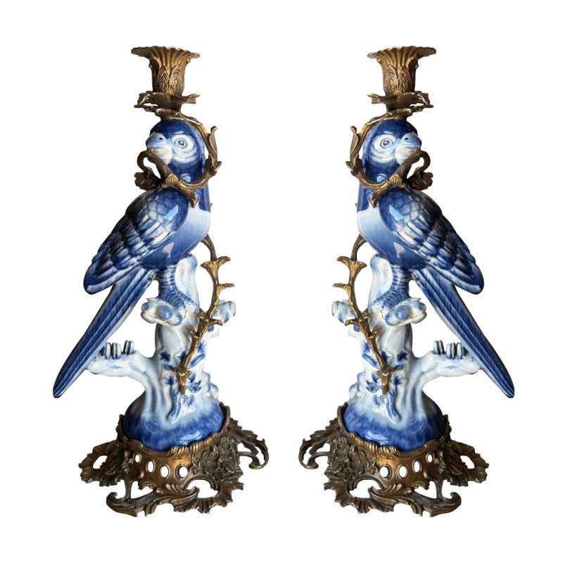 Bronze and porcelain parrot candle holders, exquisite reproduction of the Georgian originals.   Beautifully made with the exquisitely coloured porcelain parrots sitting on a very ornate swirl base of bronze, a bronze metal twist to the body of the parrot and topped with a bronze candle holder.  A great addition to a country house interior or a period city home. The perfect gift for people who have everything. Evoking a bygone age but with the colour and patina to work in any interior, these b