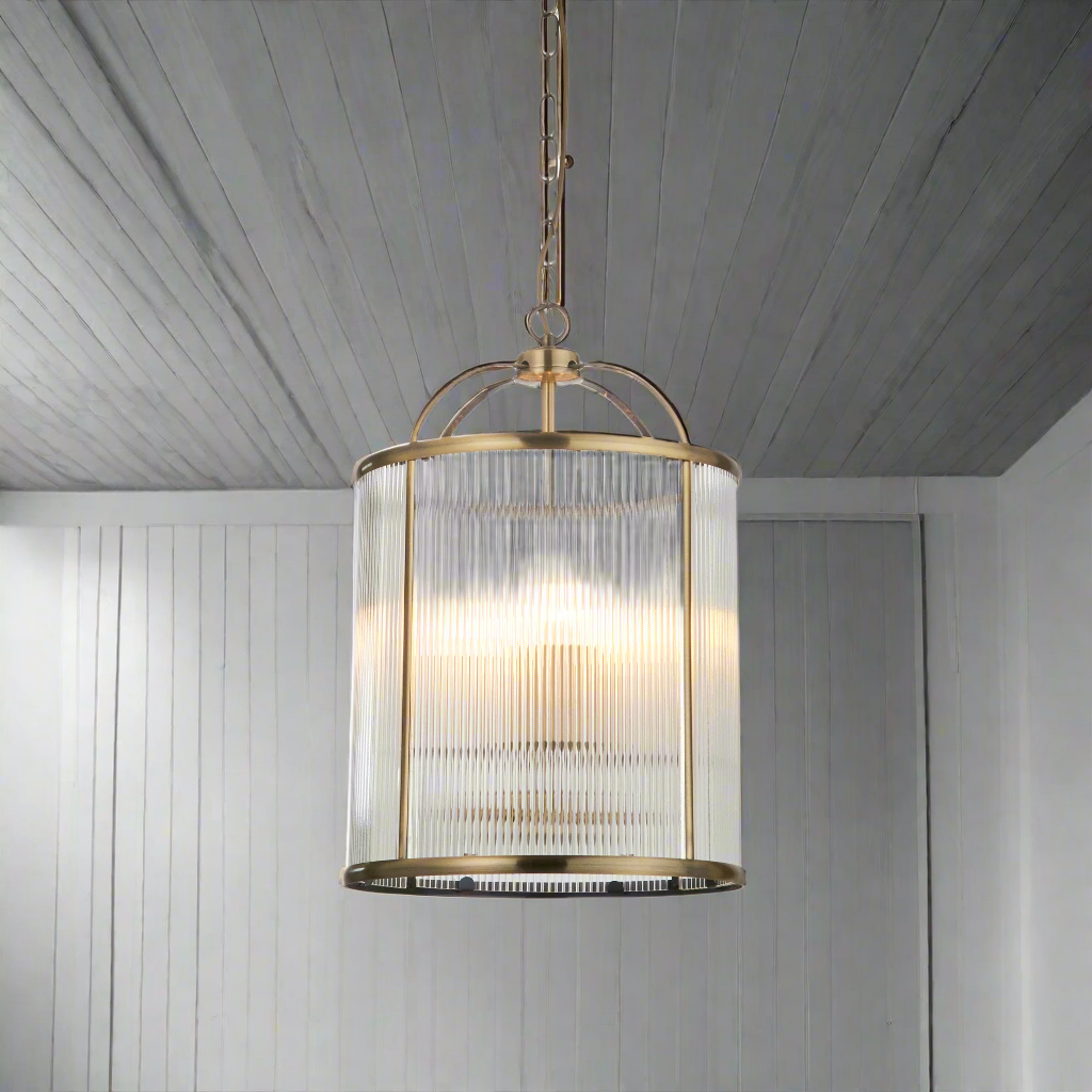 Brass metal lantern with ribbed glass, perfect hall or stair light. A classic shaped lantern unusually with ribbed glass which adds a muted effect to the light. 