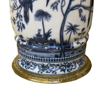 Handcrafted in superior blue and white porcelain, this delicately weighted vase features intricate bird and foliage motifs.  Bold bronze lion head handle, detailed bronze accents reflect exceptional craftsmanship.  
Ideal for living rooms, entryways, or as a centerpiece, this handcrafted vase is designed to be  a lasting beauty, heirloom piece.  
H: 33 cm W: 27 cm D: 24 cm 
Materials: Bronze and Porcelain