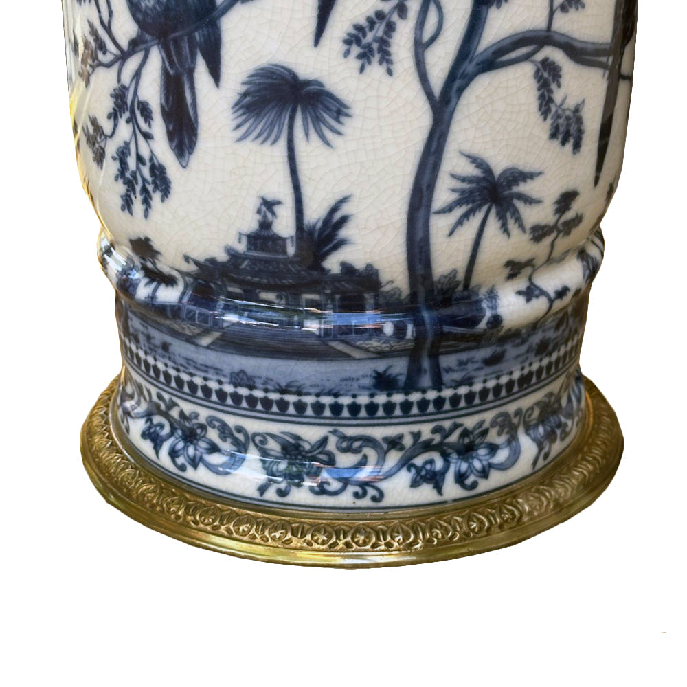Handcrafted in superior blue and white porcelain, this delicately weighted vase features intricate bird and foliage motifs.  Bold bronze lion head handle, detailed bronze accents reflect exceptional craftsmanship.  
Ideal for living rooms, entryways, or as a centerpiece, this handcrafted vase is designed to be  a lasting beauty, heirloom piece.  
H: 33 cm W: 27 cm D: 24 cm 
Materials: Bronze and Porcelain