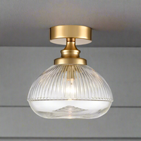 Brushed brass metal and clear ribbed glass flush pendant, perfect for a low ceiling, so good to find a flush ceiling light which is also pretty. Perfect lighting for the hall, landing or bathroom.