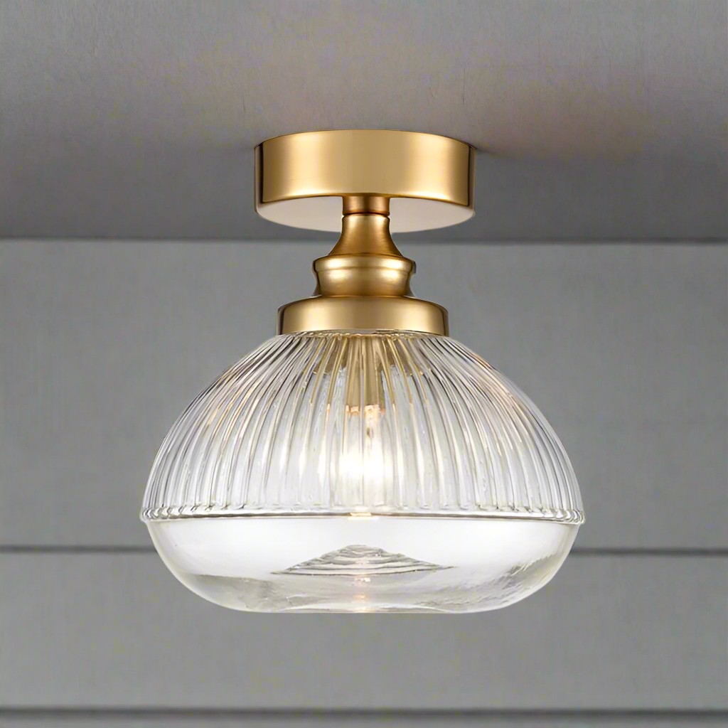 Brushed brass metal and clear ribbed glass flush pendant, perfect for a low ceiling, so good to find a flush ceiling light which is also pretty. Perfect lighting for the hall, landing or bathroom.