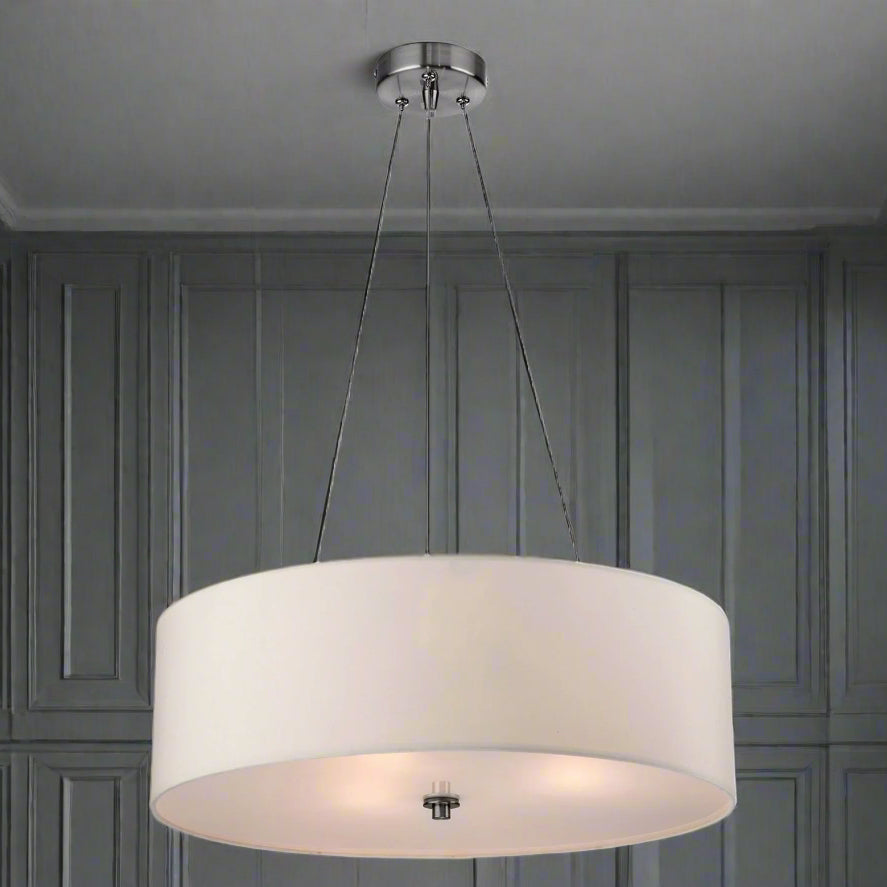 A brushed steel pendant light with a cream shade, suspended by three adjustable wires, with a frosted base diffuser.
