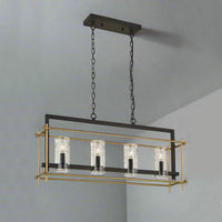 An industrial style black and gilt ceiling light, with four textured glass chimney style  lamps.  Great kitchen island or dining table light, modern with an industrial twist. Perfect with your 'Crittal' doors or windows.