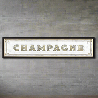 A vintage inspired wall mirrored Sign "champagne" on a black frame. A perfect retro look.