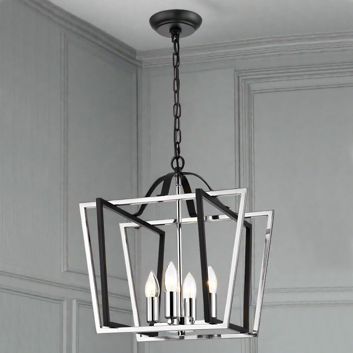 Chrome and black open four light lantern. Statement light which will be a stylish focus in any room. The ultimate hall lantern, a conte,porary take on the classic lantern look. For the hall, living room or on a landing a real statement in your home.
H: 59 cm (Min) 199 cm (Max) W: 40 cm