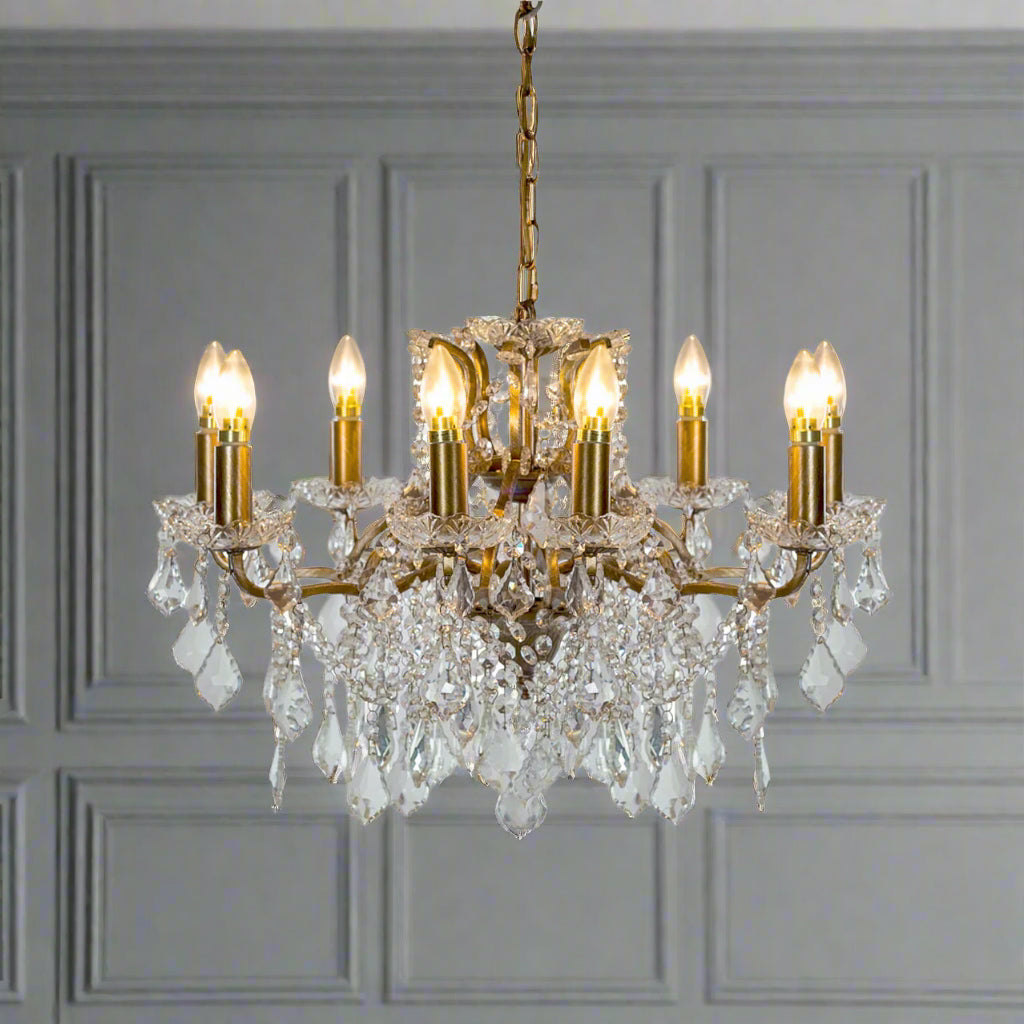 Shallow, crystal eight arm chandelier,  the classic light covered in crystal drops perfect fixture or your period home. In a bedroom, hall or smaller living room this will give you all the light you need.