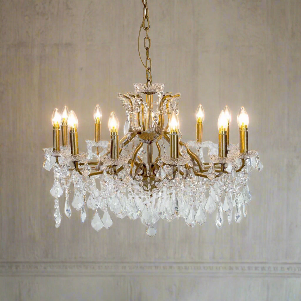 Large, shallow crystal chandelier on a gilt frame.  Classic crystal 12 branch chandelier, shallow to fit in a smaller room and perfect for the hall or sitting room of a period property.