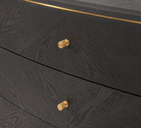 This stylish chest of drawers features a dark grey finish with great wood texture for a unique look. It is complemented by elegant brass handles and brushed gold feet.
It has three deep drawers with plenty of storage. The classic design pairs beautifully with modern and traditional decor, making it perfect for any interior design style adding a touch of luxury to any room.
