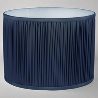 Dark blue pleated drum shades in a faux silk fabric in varying size.  A really classic pleated shade that would suit an antique column lamp or a contemporary glass based lamp beautifully.  The white inner will allow a bulb to shine through and illuminate your space. 