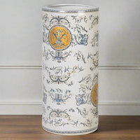 Classic scene ceramic umbrella stand. Cherubs, swags, swirls and garlands decorate this charming umbrella stand which would look 'heavenly' in your hall.  In a pretty pale grey/blue colour with gold highlights, colours that will fit in any decor.