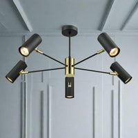 Black 5 light directional spots with gilt accents, gives a great spread of light in a neat and contemporary pendant.  Perfect, where you need directional light, in a dining room, kitchen or study.  A stylish spotlight pendant on a black metal frame with gold accents.