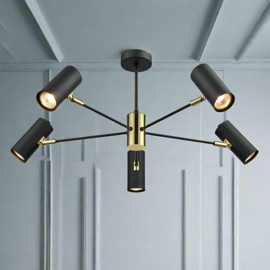 Black 5 light directional spots with gilt accents, gives a great spread of light in a neat and contemporary pendant.  Perfect, where you need directional light, in a dining room, kitchen or study.  A stylish spotlight pendant on a black metal frame with gold accents.