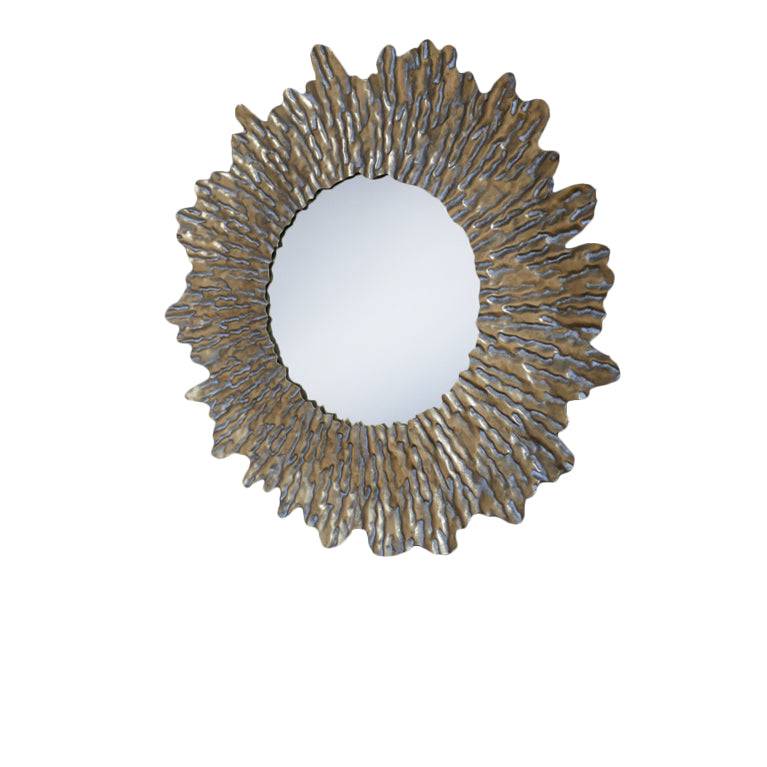 Round sun wall mirror with a distressed gold textured frame. The shape adds a touch of movement to its design. The distressed gold finish gives an antique feel