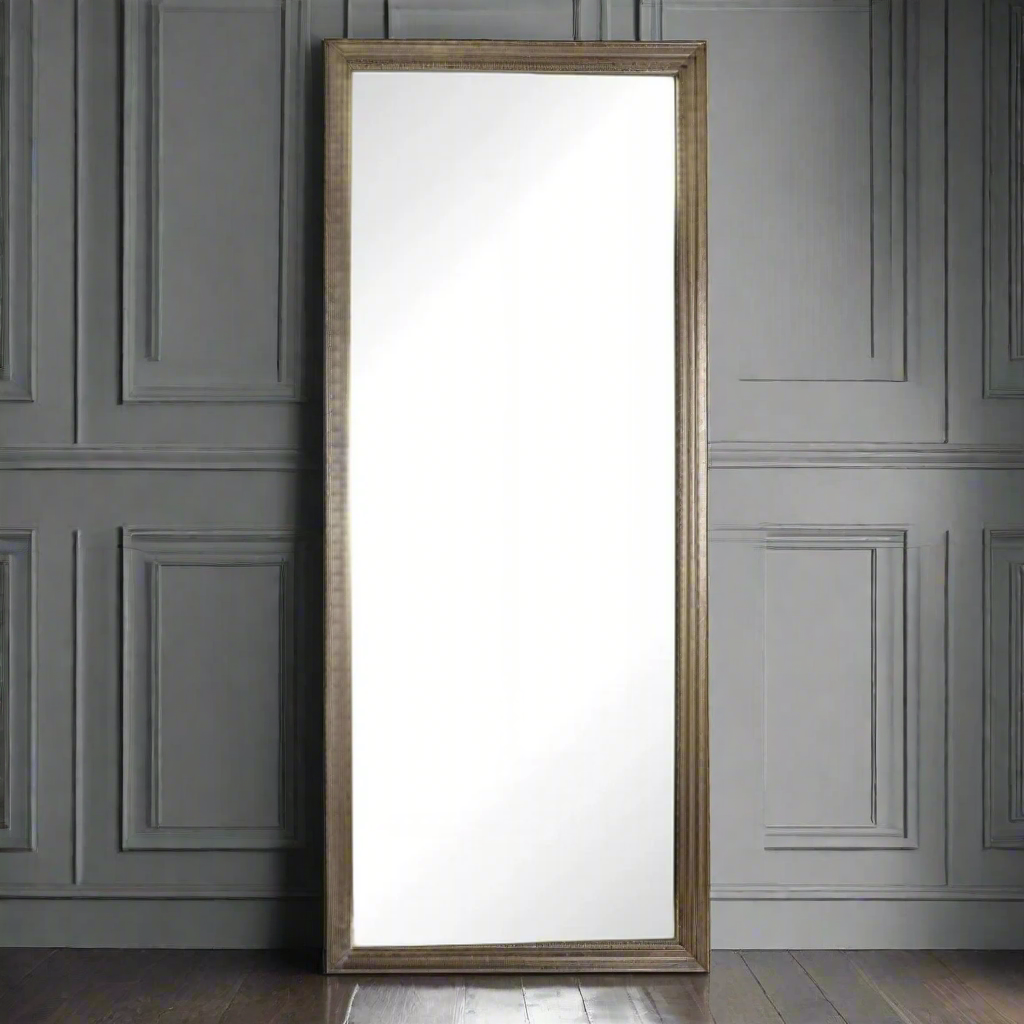 Brushed brass metal framed stepped mirror. Luxurious polished metal frame makes this the ultimate statement mirror.  An absolutely stunning mirror in looks and quality, the beautiful stepping on the gilt metal frame is exceptional.  This mirror is a great leaner in a hall or living area. Alternatively it can be hung vertically or horizontally.