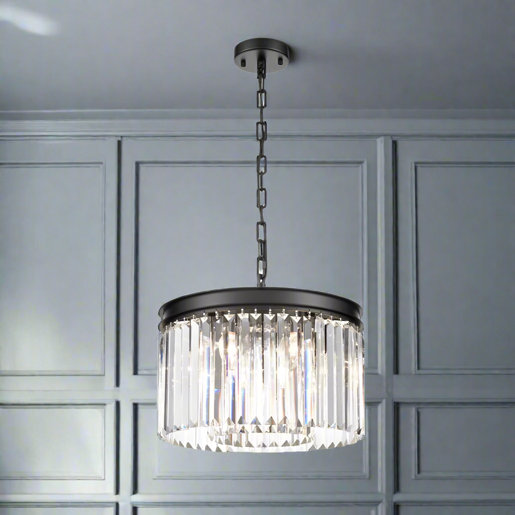 A glamorous but simple chandelier perfect for powder rooms, hallways, landings and small bedrooms for an extra touch of elegance.  Real crystal chandelier drops in a striking prism cut gives this pendant it's ultimate lux look.