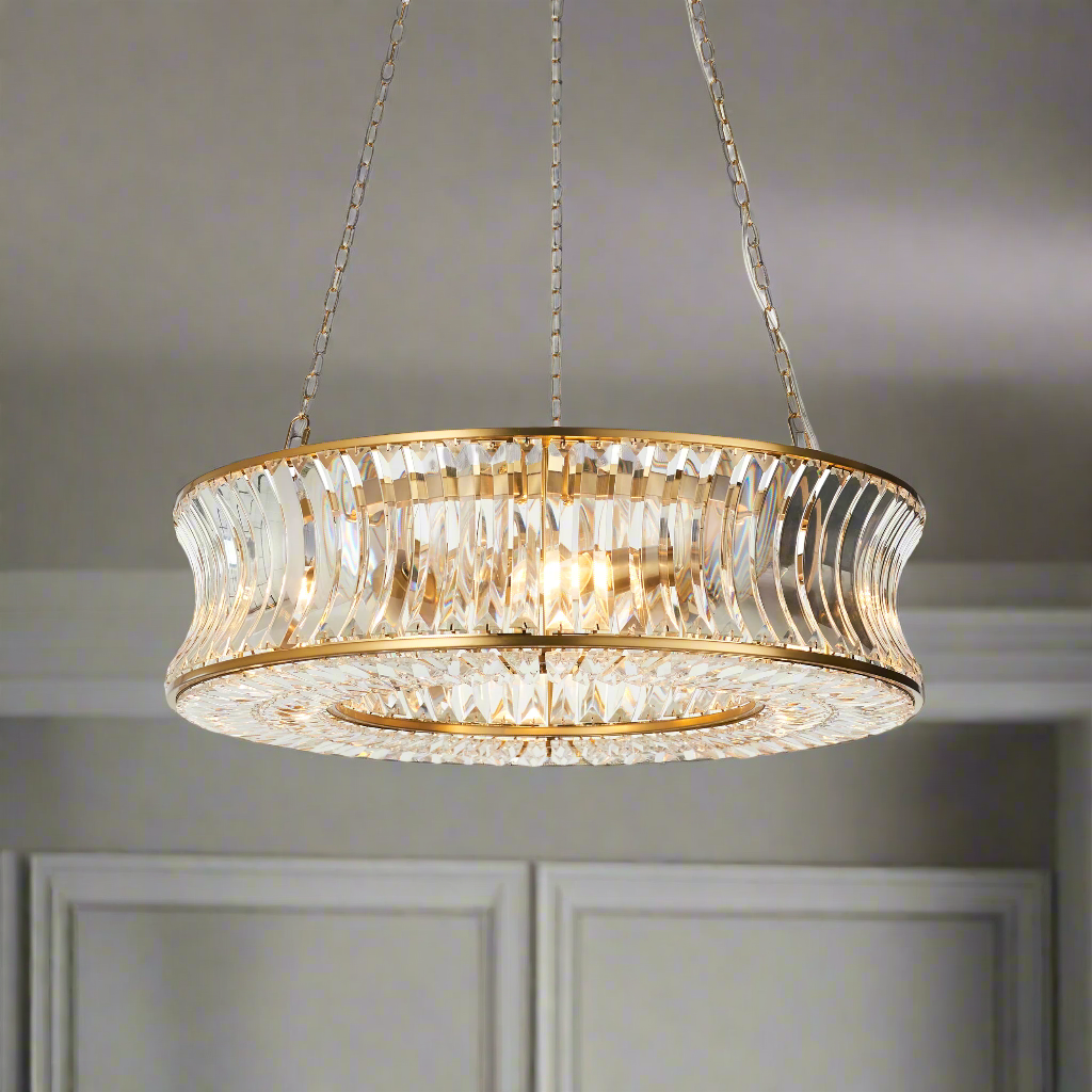 Gilt encased crystal chandelier in a 'halo' shape, large enough to make a great impression in any room on three metal chains  so that you can change the height to suit your space. Unusual concave faceted crystal drops.
W: 61 cm H: 59 cm (Min)  166 (max)