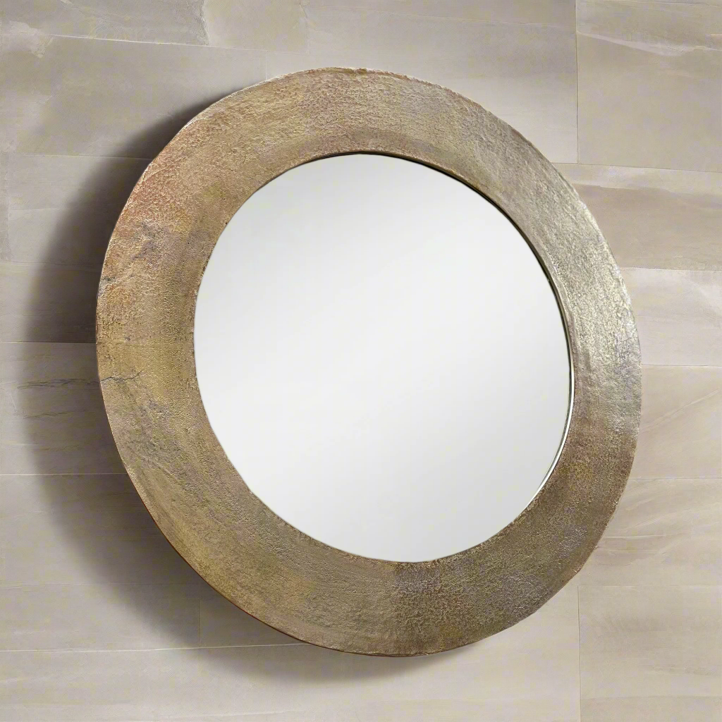 Hammered brass metal framed mirror. A great, statement circular mirror with a metal frame.  Deep metal frame in gold adds to the glamour of this exceptional mirror.