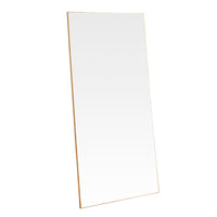 A simple and highly effective mirror minimalist in design yet maximum in impact.  With a super slim wooden gold frame that is 2cm in depth, the striking thing about this mirror is the sheer volume of glass that reflects and bounces light back into your room.  Made in the UK, this mirror is worth the wait.  Also available in black.   H: 180 cm W: 90 cm D: 2 cm  Weight: 26 kg