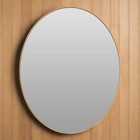 Slim framed gold oval mirror, a sophisticated look in s bathroom or bedroom. The surfact of the mirror is recessed into the slim oval gilt frame, giving a lot of mirror. 