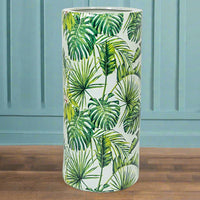 An exuberant umbrella stand with tropical leaves in a vivid green colour.  De-clutter your hall or front porch and put all your umbrellas and sticks in one place to grab and go.