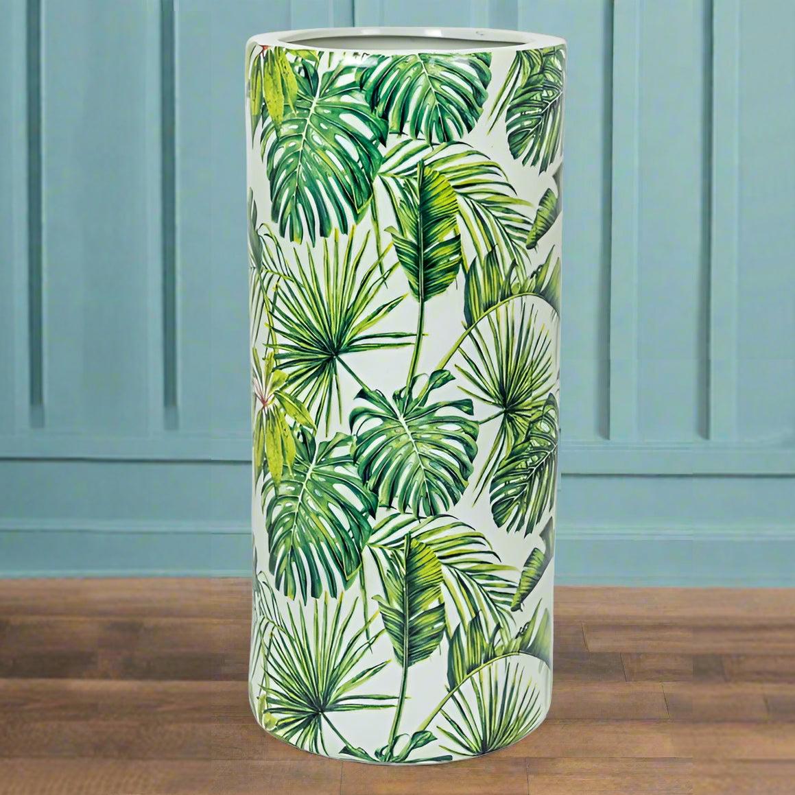 An exuberant umbrella stand with tropical leaves in a vivid green colour.  De-clutter your hall or front porch and put all your umbrellas and sticks in one place to grab and go.