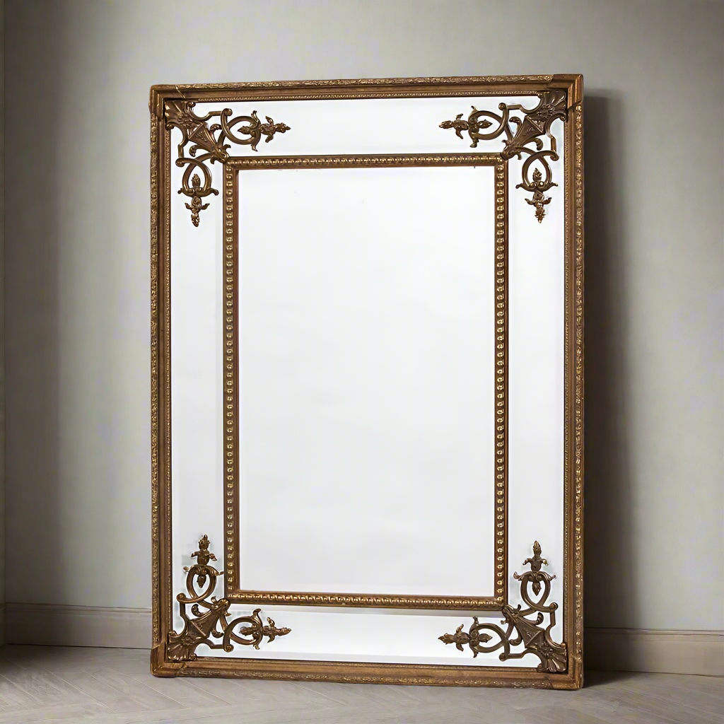Tall, slim paneled mirror with decorative corner motif. Exceptionally elegant mirror - the beveled glass panels reflecting light in any room.  A exceptionally glamorous mirror which lifts the decor in any room adding a luxurious feel as well as lighting up the room.  We have a range of ornate mirrors in the Chiswick, West London store.