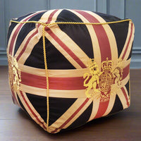 A Union Jack crested cube pouffe.  This stool is structured with a firm seat and great as an extra seat or footstool. An iconic design which will add a decorative edge to your interiors. Exceptional piece of furniture.
