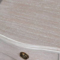 A solid hardwood three draw bedside table made from bleached mahogeny wood with ash veneers in a white wash finish.