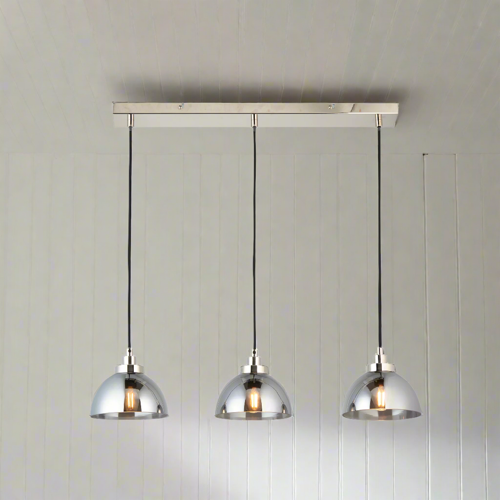 3 light linear pendant, perfect kitchen island or dining table light. Smoked glass pendants on a striking chrome plate with chrome accents. Such an easy way to add a touch of luxury and interest to your room.
